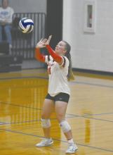 Libero Lily Beel overhead digs a ball spiked by a Spartan during the team’s first round of subdistrict play.