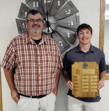 Morgan Kinney (right) receives the Athlete of the Year plaque from KBRB Radio owner Graig Kinzie.
