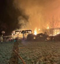 The fire started in the attached garage of Mike and Wanda Johnson, and quickly spread to the house. The garage and house were total losses. Photo Courtesy of Devin Painter