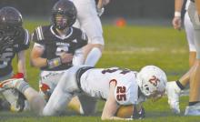 Sophomore Easton McMillin lands after being tackled during the team’s Friday night game in Neligh.