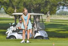 Gracyn Peterson putts during Thursday's youth golf tournament in Ainsworth.