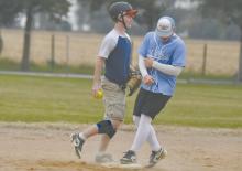Ainsworth’s Sam Titus and Witten Painter nearly collide as Titus attempts to get Painter out. Titus won the costume contest dressed as Clark from The Benchwarmers.