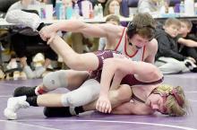 Dylan Titus placed third in the 126 lb. weight class at the Burwell Invitational. Photos by Devin Painter