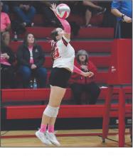 Freshman Payton Sears attacks a ball set by teammate Willa Flynn.
