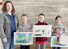 BREMA Deputy Jessica Pozehl stands with the Brown County 3rd Graders top three severe weather poster winners, which were sent on to Lincoln for competition. They are Landon Arens, Jett Hansmeyer and Rowan Alberts.