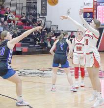 Sophomore Jaylee Good pulls up for a three point shot as O’Neill freshman Taylor Young rushes to play defense.
