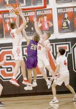 Trey Appelt goes up for one of his 14 rebounds. Appelt scored 18 points in the Dawgs overtime loss to Holdrege.
