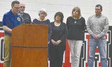 Scott Steinhauser presents the family of Larry Rice with the Melvin Jones Fellow Award.