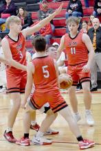 The Ainsworth Basketball Team struggled against Anselmo-Merna’s height advantage as evidenced by three Coyote players surrounding Ryan Salzman.