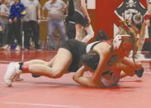 Megan Jones wrestles an opponent during the Plainview Invite last season. Jones, a senior, looks to make her third state wrestling appearance to cap off her career.