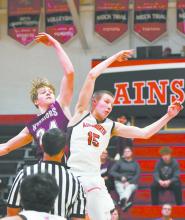 Sophomore Jacob Ortner wins the tip-off against Neligh-Oakdale’s Jase Schmoldt.