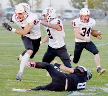 Following taking the opening kickoff down to North Central’s 25 yard line, Jacob Held, #34, took the first place from scrimmage in for a 25-yard touchdown run with Owen Blumenstock, #5, and Morgan Kinney, #2, providing blocking.