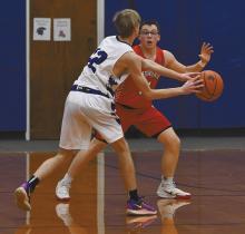 Ryan Salzman plays defense on North Central’s Trey Anthony.