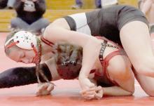 Megan Jones, wrestling in the 135 lb. weight class, took first place pinning all three of her opponents.