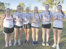 The Ainsworth Cross Country teams competed in their first Niobrara Valley Conference Meet. The girls team won the invite. Members of the winning team are (left - right): Danni Bolli (16th place), Addilyn Doke (13th place), Izzy Painter (14th place), Kiley Orton (fourth place), Payton Moody (eighth place), and Reagan Moody (second place).