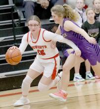 Gracyn Painter drives for the basket against Holdrege. Painter scored 16 points in the game.