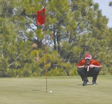 Freshman Jaxon Rucker lines up a putt during the dual in Valentine.