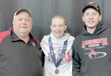 Ainsworth sophomore Jolyn Pozehl came home with a bronze medal from the NSAA State Wrestling Tournament, held February 16th - 18th in Omaha. Head Coach Todd Pollock and Assistant Coach Oren Pozehl helped lead Jolyn to a third place finish in the girls 115 lb. weight class.