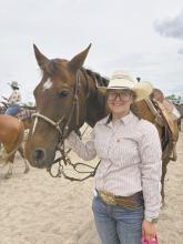 Madison Palmer with her horse, Tank.