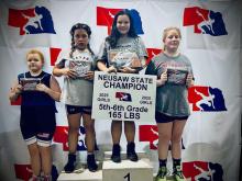 Adeline Hladky (third from left) placed first at the NEUSAW State Wrestling Championships. Hladky wrestled in the 165 pound weight class, in the 5th and 6th grade division. Other local wrestlers competing at this meet were Mason Winters (8th place), Preston Winters (6th place), Dallyn Dailey (2nd place), and Chazlee Dailey (6th place.)