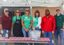 Staff members of the Ainsworth Homestead Bank served customers during an appreciation barbecue on Wednesday, June 24.
