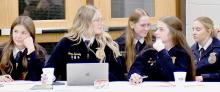 Ainsworth FFA Officers assisting Auctioneer Mike Baxter with taking down bids and bidder names during the Ainsworth FFA Hired Hand Auction were (left to right): Miah Ortner, Emma Kennedy, Megan Jones, Londyn Dunbar and Preselyn Goochey.