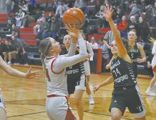 Preselyn Goochey shoots the ball from below the hoop.