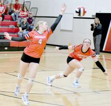 Kinsey Walz goes up for the serve and Gracyn Painter was backing her up before the volleyball hit the floor.