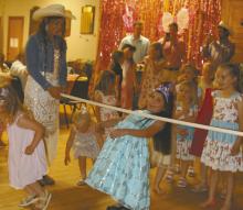 The Ainsworth Does Drove hosted its annual Daddy Daughter Dance on Saturday, May 2. Atendees above do the limbo during the dance.