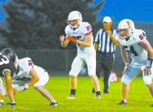 Sophomore Easton McMillin (25) waits for the ball to be snapped as the Dawgs prepare to run the ball.