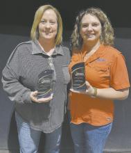 Jean Engle (left) and Jessica Pozehl (right) stand with their awards from the Nebraska Association of Emergency Managment Nebraska Association.
