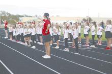 Junior Madison Palmer cheers alongside the Little Dawg Cheerleaders during Friday’s game.