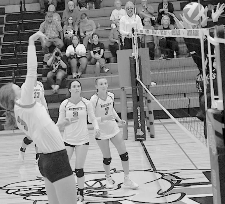 Eden Raymond hit the ball back between two West Holt Lady Huskies.