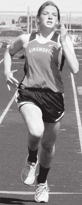 Jolyn Pozehl takes third in the Jr. High 200 Meter Dash. Pozehl won the Jr. High Pole Vault, clearing 8’ 6’’ and was on the first place Jr. High 800 Sprint Medley team.