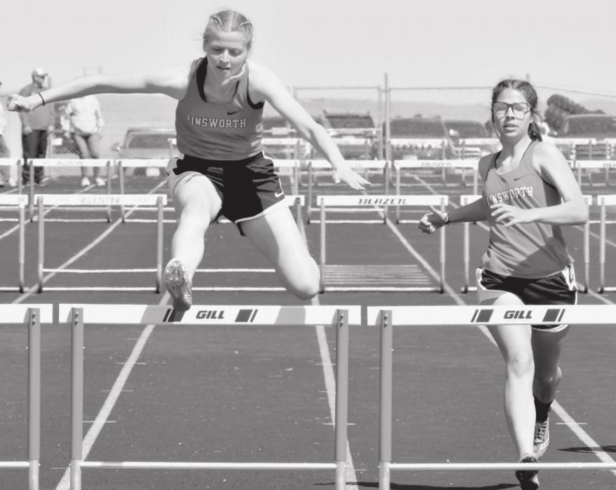 Sophie Wilson (left) and Kaitlynn Inbody (right) run the Girls Varsity 300 Meter Hurdles. Wilson placed sixth with a time of 55.25, and Inbody placed seventh with a time of 56.07.