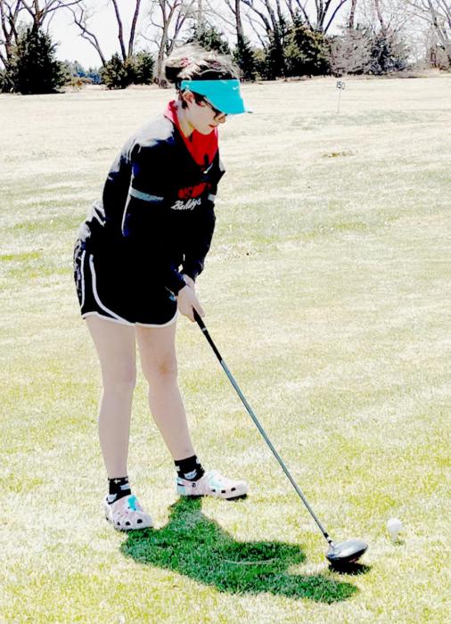 Jodie Denny tees off at the Bassett Middle School Golf Tournament on April 21st.