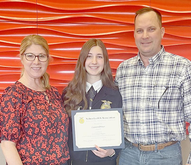 Lauren Ortner (center) received her State FFA Degree. She is pictured with her parents Kate and Ryan Ortner.