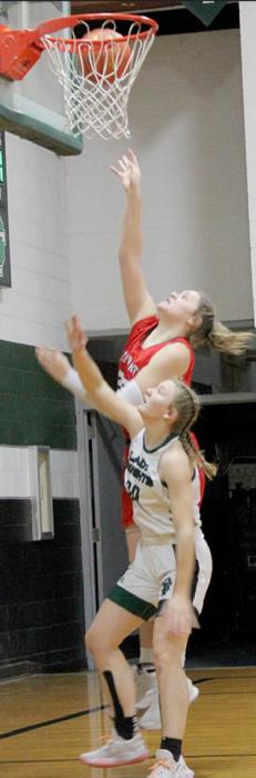 Karli Kral out-jumps a Sandhills/Thedford defender for two of her eight points on the night.