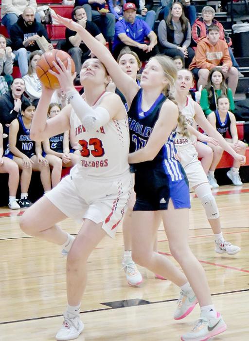 Karli Kral goes for a put-back of a rebound and headed to the free throw line after being fouled.