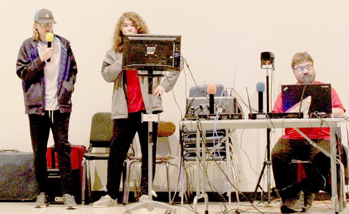 Lars Johnson (left) and Jace Haskell (right) took their turn performing Karaokee with Monte Mauch’s (seated) Kopy Cat Karaokee.