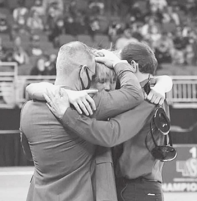 Chris Williams came away from NSAA State Wrestling a three time champion! At left, he wrestles his way to the middle photo - a champion! In the photo at right Chris hugs his coaches Shane Allison and Robert Joesph. Photos by DeanNa Fowler