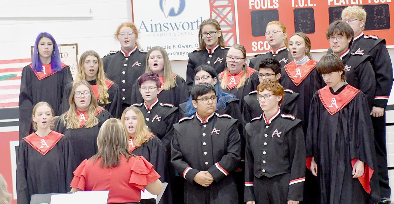 Ainsworth High School Choir under the direction of Kayla Nilson and accompanied by Sherry Campbell performed “Blade of Grass and Pure White Stones” and “A Tribute to the Armed Services”.