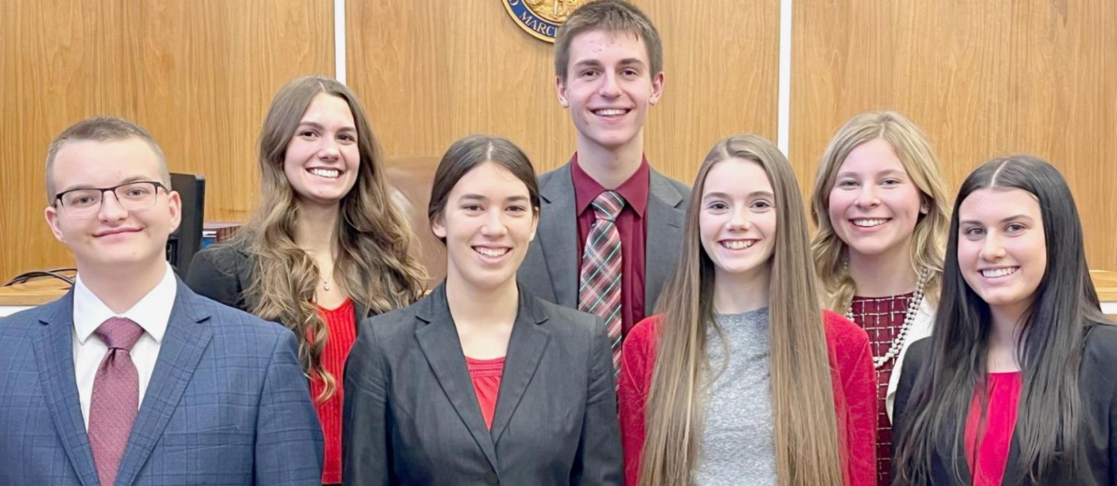 Qualifying members of the Ainsworth Blue Mock Trial team are: (Front Row - Left to Right): Gavin Olinger, Katherine Kerrigan, Taylor Allen and Dakota Stutzman; (Back Row - Left to Right): Haley Schroedl, Benjamin Flynn and Alyssa Erthum.
