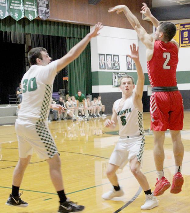 Caleb Allen shoots a three-pointer over Knights defenders.