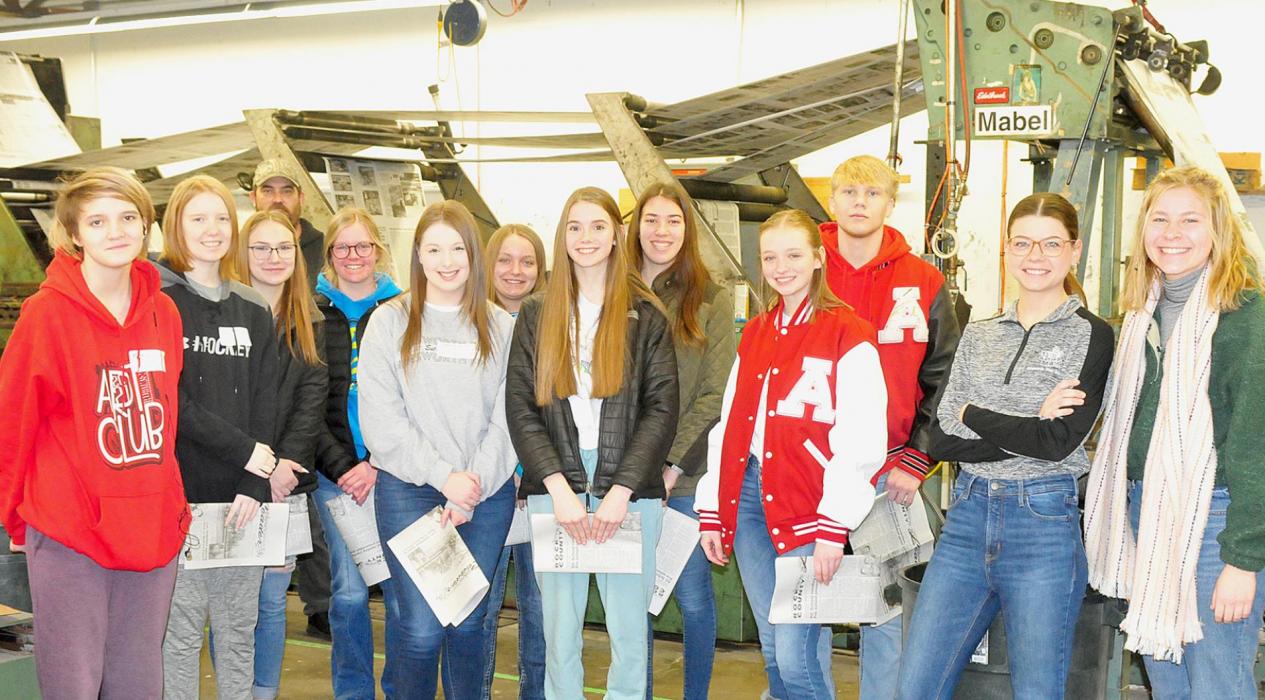 This group of tri-county sophomores and juniors visited the Ainsworth Star-Journal during the BKR Extension Career Fair on February 23rd. They listened to Pressman Matt Esterly (far back) explain the press as it printed newspapers and learned more about journalism, editing, communications and advertising careers from (far right to left) C.O.E. student Alyssa Erthum and Associate Editor Lydia Allen.