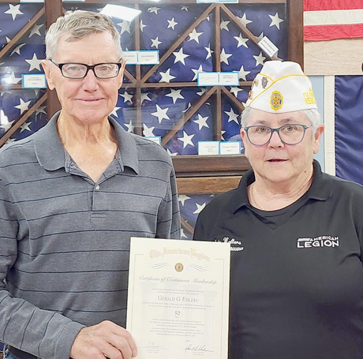 Gerald Ehlers (left) was presented his 50 Year Continuous Membership Certificate in the American Legion by Post #79 Commander Judy Walters (right).