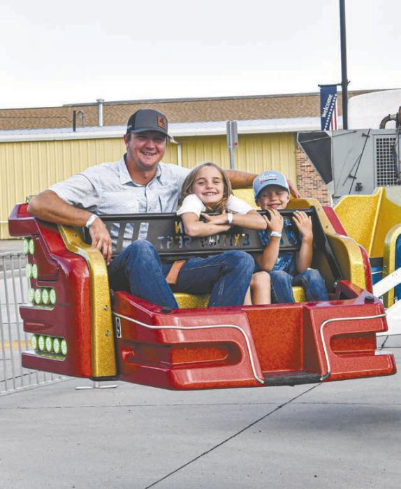 The D.C. Lynch Carnival was held on Main Street in Ainsworth June 12-14. Above is Dustin Dailey with his children Chazlee and Dawson.