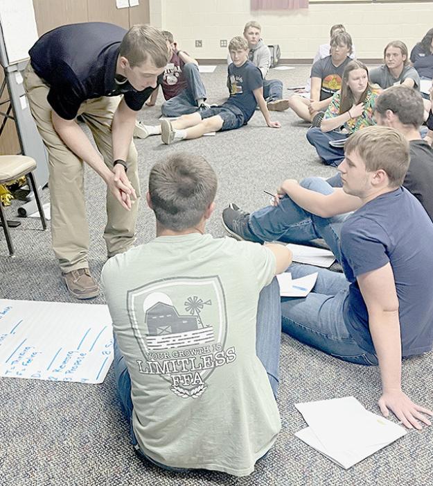 Trey Appelt works with Nebraska State FFA President Thomas Perrin during an officer work session. Trey interacted with FFA Chapter Presidents from across the state as they worked towards identifying what it takes to be a good leader.