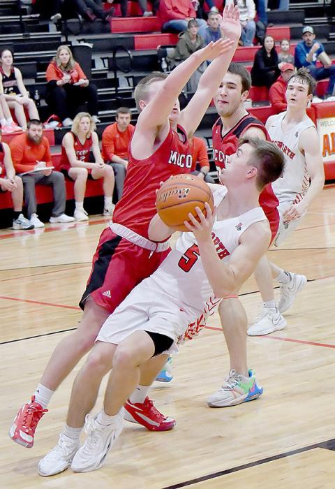 Traegan McNally had to put on the brakes and ended up drawing a foul as Bryson Gullion attempted to block his drive on the basket.