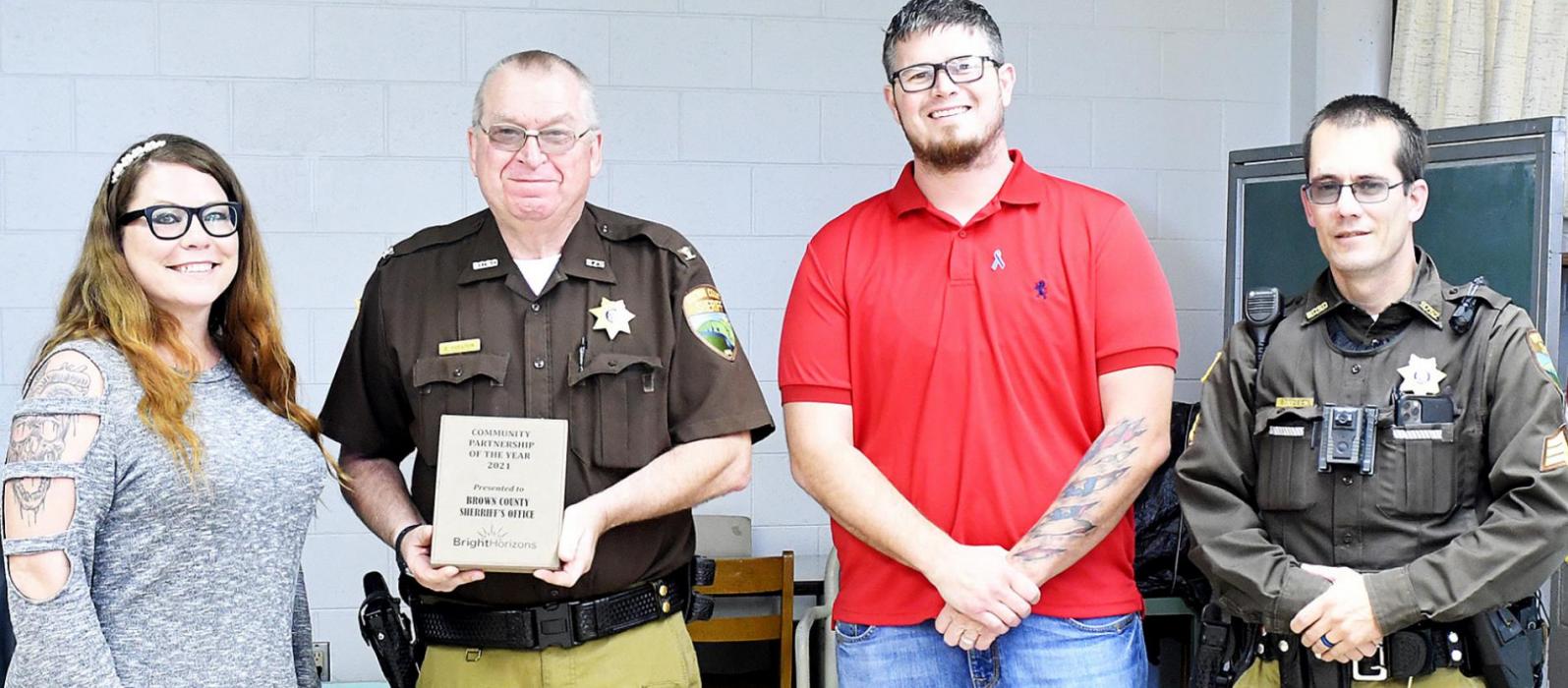 Bright Horizons presented the Outstanding Community Partnership Award to the Brown County Sheriff’s Department on October 19th for Domestic Violence Awareness Month. Left to Right: Misty Rowley, Sheriff Bruce Papstein, Josh Miller and Deputy B.J. Nilson.